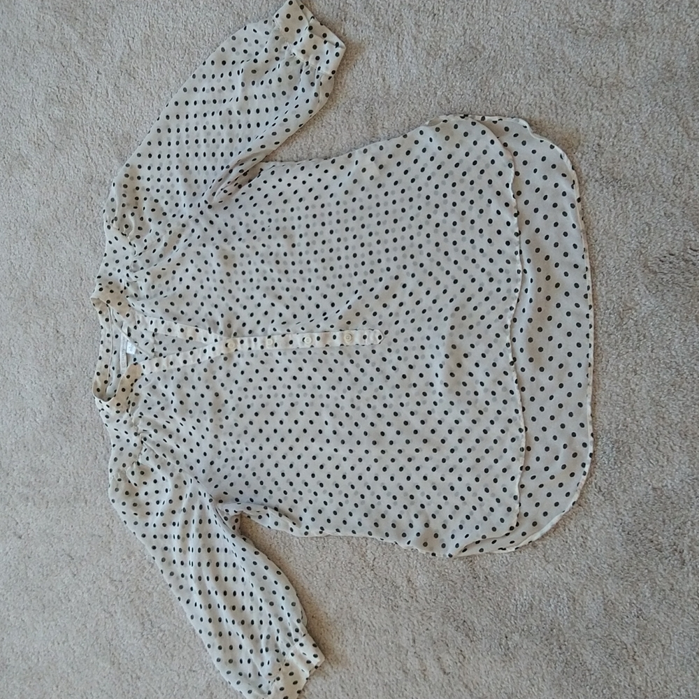 An LC Lauren Conrad white sheer blouse with black dots size Large
